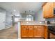 Kitchen countertop view toward a living room with a fireplace and stairwell at 1623 Ivy Spring Se Dr, Smyrna, GA 30080