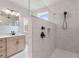 Bathroom highlighting modern vanity and glass-enclosed shower with black shower hardware and built-in toiletry niche at 7525 Homer Dr, Cumming, GA 30028