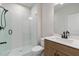 Modern bathroom with a glass-enclosed shower, sleek vanity, and neutral finishes at 7525 Homer Dr, Cumming, GA 30028