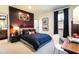 This is a bedroom with black comforter, basketball hoop, desk, and large windows with black curtains at 7525 Homer Dr, Cumming, GA 30028