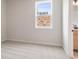 Bright bedroom with neutral carpet, a single window offering natural light, and a calming atmosphere at 7525 Homer Dr, Cumming, GA 30028