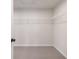 Walk-in closet with neutral carpet and a white wire shelf for simple storage at 7525 Homer Dr, Cumming, GA 30028
