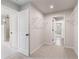 Walk-in closet with white wire shelves and access to the bathroom and bedroom at 7525 Homer Dr, Cumming, GA 30028