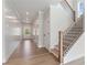 Inviting entryway with a staircase and light wood floors at 7525 Homer Dr, Cumming, GA 30028