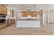 Stylish kitchen with an island, stainless steel appliances, and wood cabinets at 7525 Homer Dr, Cumming, GA 30028