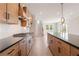 Modern kitchen features a gas range, granite countertops, and a large island at 7525 Homer Dr, Cumming, GA 30028