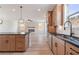 Bright kitchen featuring wood cabinets, stainless steel appliances, and a kitchen island at 7525 Homer Dr, Cumming, GA 30028