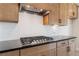 Modern kitchen featuring granite countertops, stainless steel appliances, and a gas range at 7525 Homer Dr, Cumming, GA 30028