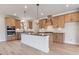 Modern kitchen featuring an island, stainless appliances, and ample cabinet space at 7525 Homer Dr, Cumming, GA 30028
