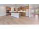Spacious kitchen with stainless steel appliances, island, and wooden cabinets at 7525 Homer Dr, Cumming, GA 30028