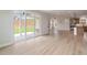 The spacious living room offers hardwood flooring, a cozy fireplace, and sliding doors to the backyard at 7525 Homer Dr, Cumming, GA 30028