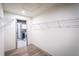 Spacious walk-in closet with wire shelving and door to laundry room at 7525 Homer Dr, Cumming, GA 30028