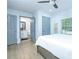 Bright bedroom with ensuite bathroom, hardwood floors, natural light, and large windows at 2410 Macon Sw Dr, Atlanta, GA 30315