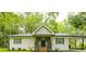 Charming renovated home with a well-maintained lawn, wood trim, and ample natural light at 2410 Macon Sw Dr, Atlanta, GA 30315