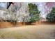 Large backyard with a basketball hoop and mature trees at 5004 Duxford Se Dr, Smyrna, GA 30082