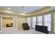 Basement featuring neutral carpet, a comfy chair, a dresser, and bright windows at 5004 Duxford Se Dr, Smyrna, GA 30082