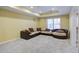 Basement featuring neutral carpet, a sectional couch, and an easy-access door at 5004 Duxford Se Dr, Smyrna, GA 30082