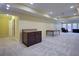 Finished basement with gray carpet flooring, storage, and walk out at 5004 Duxford Se Dr, Smyrna, GA 30082