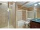 Bright bathroom featuring a glass shower, soaking tub, and a vanity with and glass bowl sinks at 5004 Duxford Se Dr, Smyrna, GA 30082