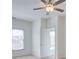 A bright bedroom with carpet, a ceiling fan, and a window at 5004 Duxford Se Dr, Smyrna, GA 30082