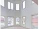 Bright bonus room with high ceilings, carpet, and multiple windows offering natural light at 5004 Duxford Se Dr, Smyrna, GA 30082
