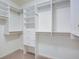 A bright, custom walk-in closet with installed storage solutions at 5004 Duxford Se Dr, Smyrna, GA 30082