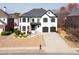 Beautiful home with a well-manicured lawn and a two-car garage at 5004 Duxford Se Dr, Smyrna, GA 30082