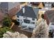 Aerial view showcases the home's back deck, patio, and blossoming trees at 5004 Duxford Se Dr, Smyrna, GA 30082