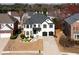 Beautiful two-story home with a black and white color scheme and well-manicured lawn at 5004 Duxford Se Dr, Smyrna, GA 30082