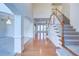 Grand foyer with high ceilings, hardwood floors, staircase, and elegant chandelier at 5004 Duxford Se Dr, Smyrna, GA 30082