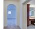 Hallway with arched doorway leading to a bedroom and a view of a bathroom vanity at 5004 Duxford Se Dr, Smyrna, GA 30082