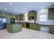 Well-appointed kitchen with a center island, granite countertops, stainless appliances and an open layout at 5004 Duxford Se Dr, Smyrna, GA 30082