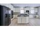 Bright eat-in kitchen featuring stainless steel appliances, a large island, and white cabinetry at 5004 Duxford Se Dr, Smyrna, GA 30082