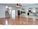 Hardwood floors connect the open-concept living room to the kitchen and staircase at 5004 Duxford Se Dr, Smyrna, GA 30082