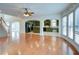Open floor plan connects the living room to the kitchen with views of the staircase and bay window at 5004 Duxford Se Dr, Smyrna, GA 30082