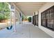 Covered patio area with swing offers a relaxing outdoor space at 5004 Duxford Se Dr, Smyrna, GA 30082