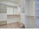 Bright walk-in closet featuring custom shelving and ample storage space for clothes and accessories at 5004 Duxford Se Dr, Smyrna, GA 30082