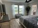 Comfortable bedroom featuring a large window, neutral decor, and en suite bathroom access at 5372 Tolar Rd, South Fulton, GA 30213