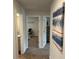 Bright hallway features neutral walls, art, and leads to a room at 5372 Tolar Rd, South Fulton, GA 30213