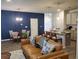 Cozy living room with designer accent wall, open floor plan and island seating at 5372 Tolar Rd, South Fulton, GA 30213