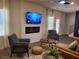 Cozy living room with a modern fireplace, comfortable seating and large windows at 5372 Tolar Rd, South Fulton, GA 30213