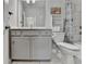 Bathroom featuring a sleek vanity with storage and a shower with custom tile at 373 Via Secco Ln, Suwanee, GA 30024