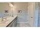 Bathroom with double sink vanity with large mirror at 373 Via Secco Ln, Suwanee, GA 30024