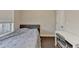 Bedroom with a bed, desk, and window featuring bright, natural light at 373 Via Secco Ln, Suwanee, GA 30024