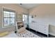 Bright bedroom with hardwood floors and a comfortable bed at 373 Via Secco Ln, Suwanee, GA 30024