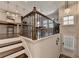 View of the dining area and kitchen from the top of the stairs of the entry area at 373 Via Secco Ln, Suwanee, GA 30024