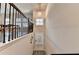 Entryway with decorative lighting, black metal railing and a full view of the dining area at 373 Via Secco Ln, Suwanee, GA 30024