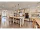 Open concept kitchen with an island, pendant lighting, and stainless steel appliances at 373 Via Secco Ln, Suwanee, GA 30024