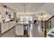 Kitchen with stainless steel appliances, granite countertops, modern lighting, and hardwood floors at 373 Via Secco Ln, Suwanee, GA 30024