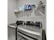 Modern laundry room with newer washer and dryer on upper level at 373 Via Secco Ln, Suwanee, GA 30024